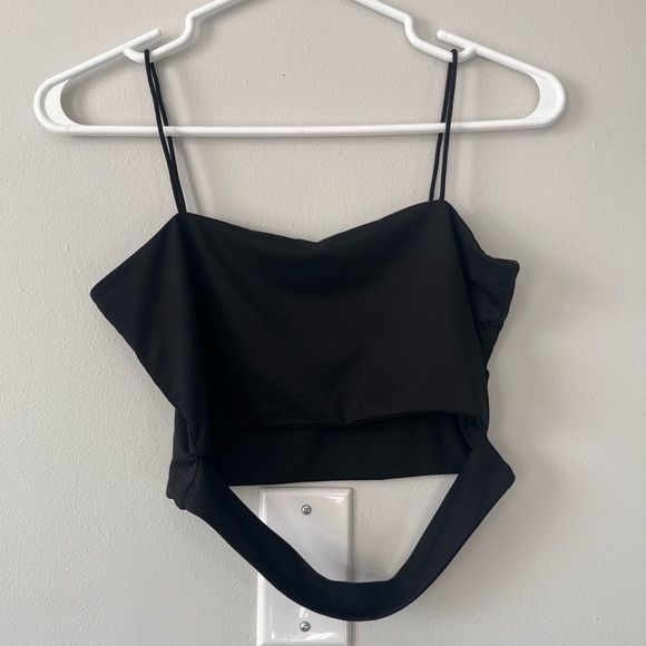 Black cropped tank top with strap in front. - Picture 1 of 1